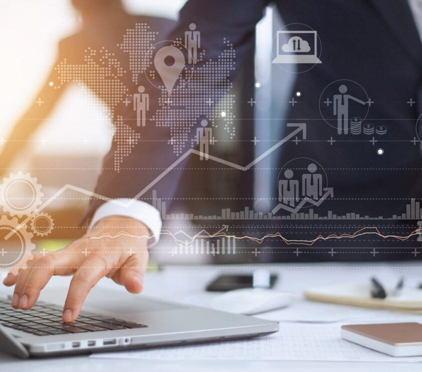 Businessman working using laptop computer with strategy and growth of business on screen