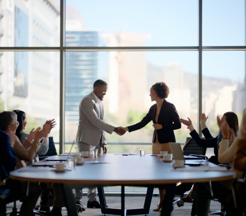 Meeting, handshake and business people in office for interview, welcome applause or onboarding for collaboration. Men, women and shaking hands in conference room for agreement, consulting or b2b deal